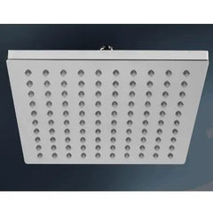 Square shower head with multiple holes on a dark background