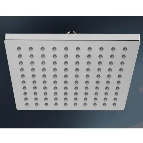 Square shower head with multiple holes on a dark background