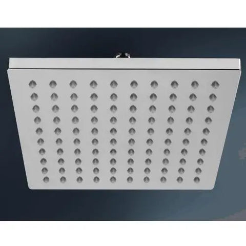 Square shower head with multiple holes on a dark background