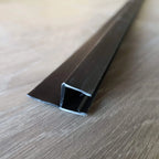 Black H-shape shower door side seal showing the glass channel and sealing fin