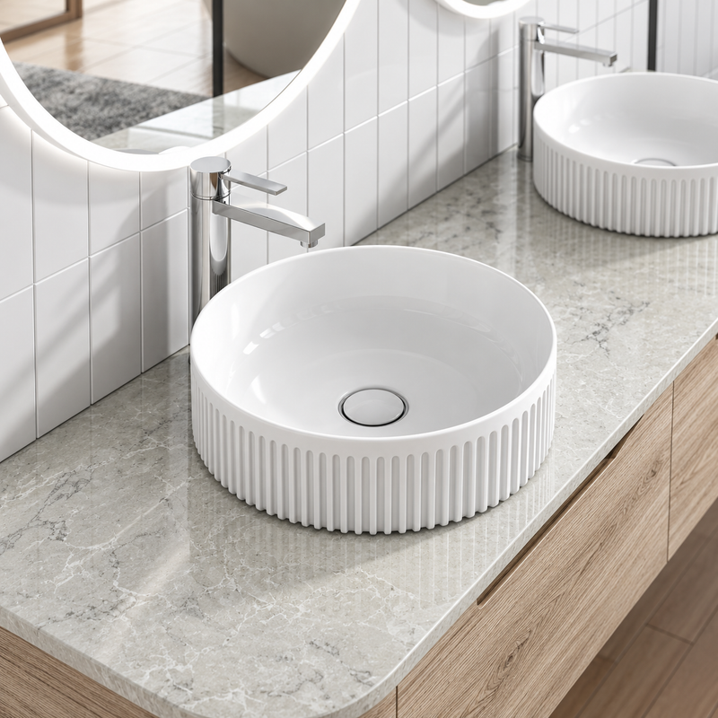 Aliso white fluted above counter basin on a stone benchtop